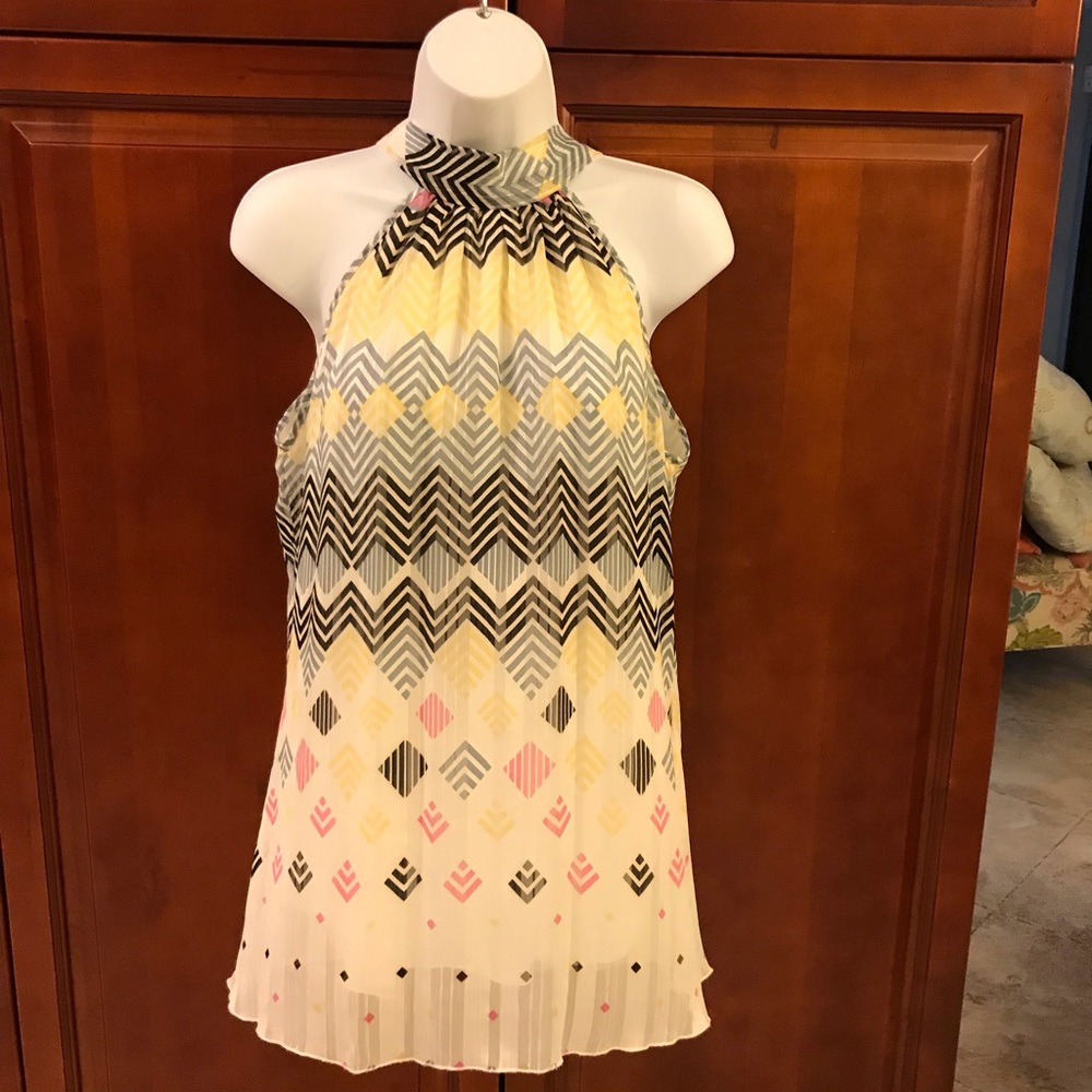 Multi-colored sleeveless blouse.